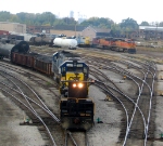 CSX GP15s switch the yard with an RCO Sled